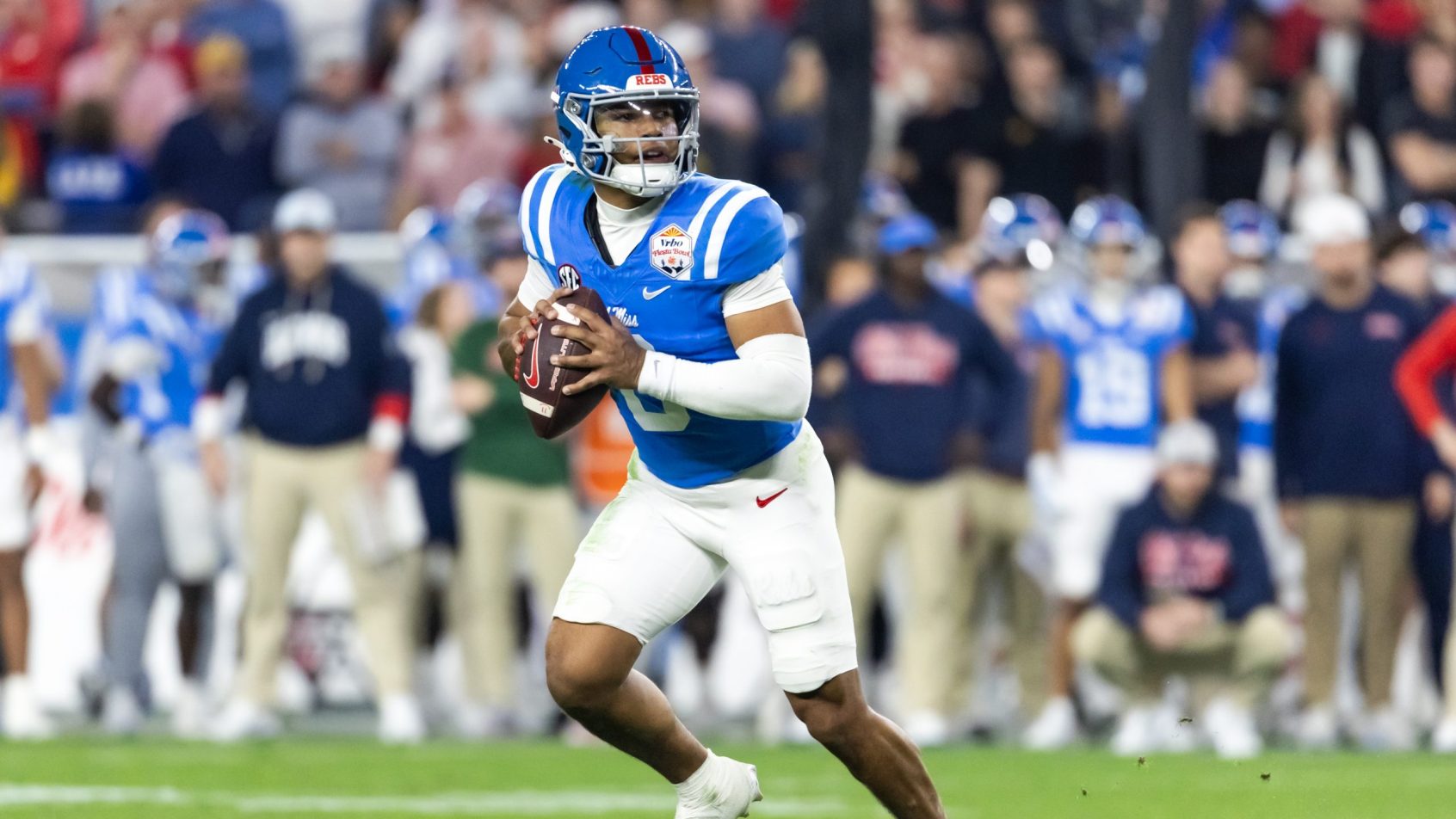 Trinidad Chambliss escapes the pocket in the 2026 Fiesta Bowl.