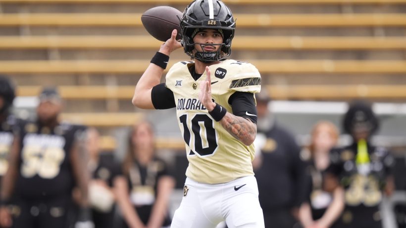 Colorado's Julian Lewis drops back to pass during a spring game.