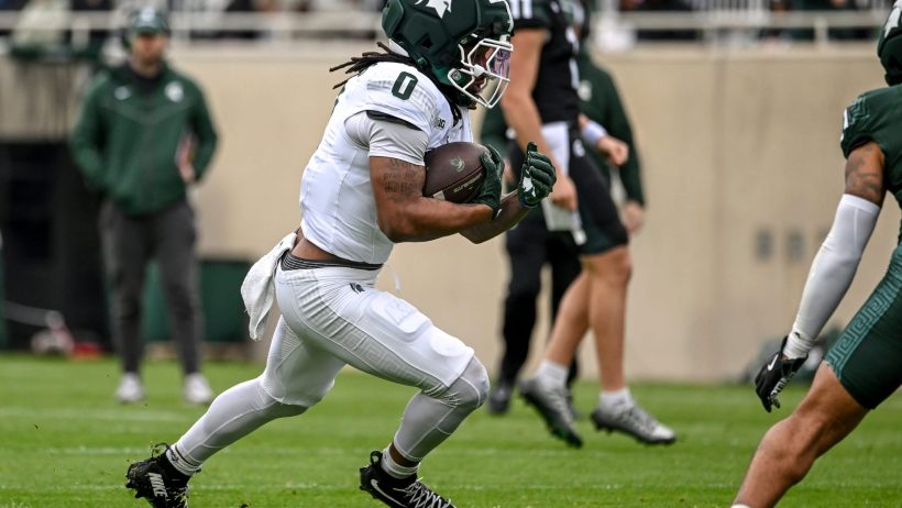 Cam Edwards rushing the ball for Michigan State during the spring showcase.