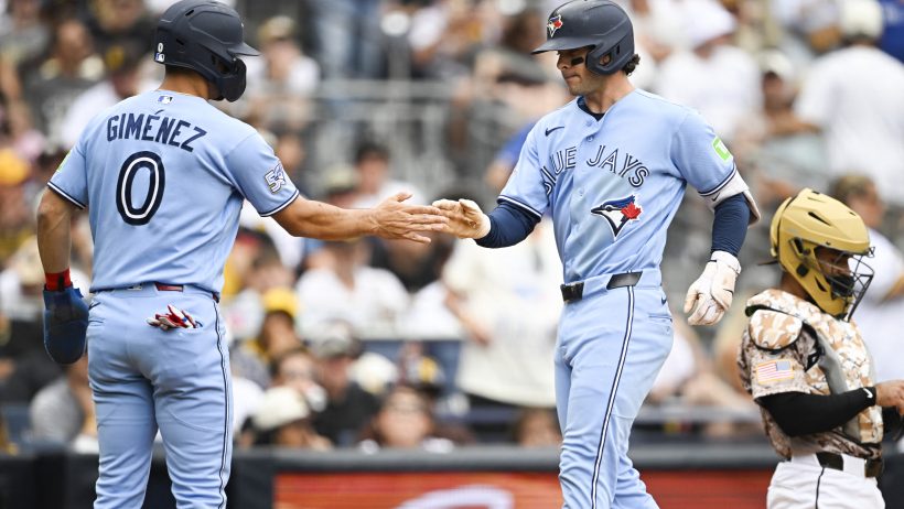 Ernie Clement celebrates with shortstop Andrés Giménez