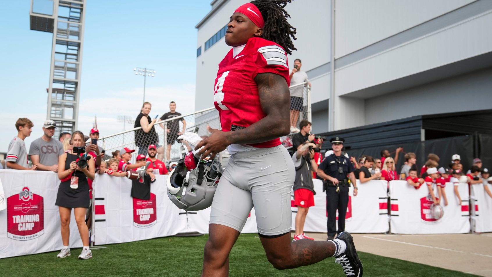 Jeremiah Smith runs onto the field during an Ohio State practice.