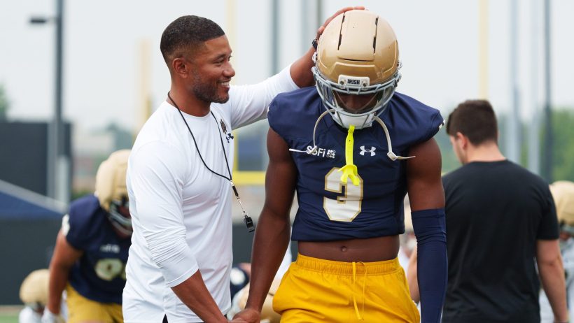 Marcus Freeman congratulates Mylan Graham during practice.