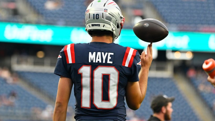 Drake Maye spins football on hand
