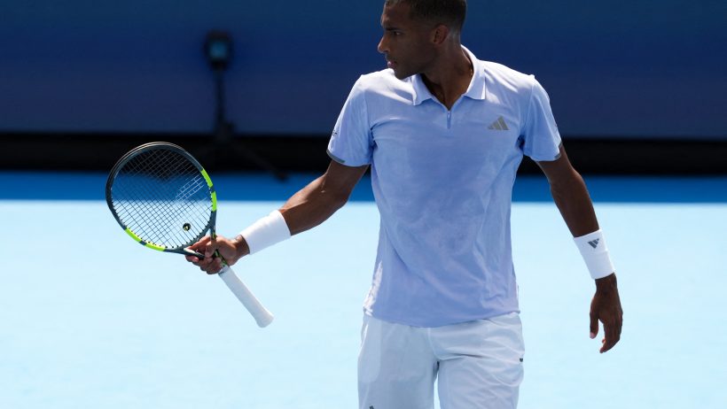 Felix Auger-Aliassime holding racquet, pumped reaction