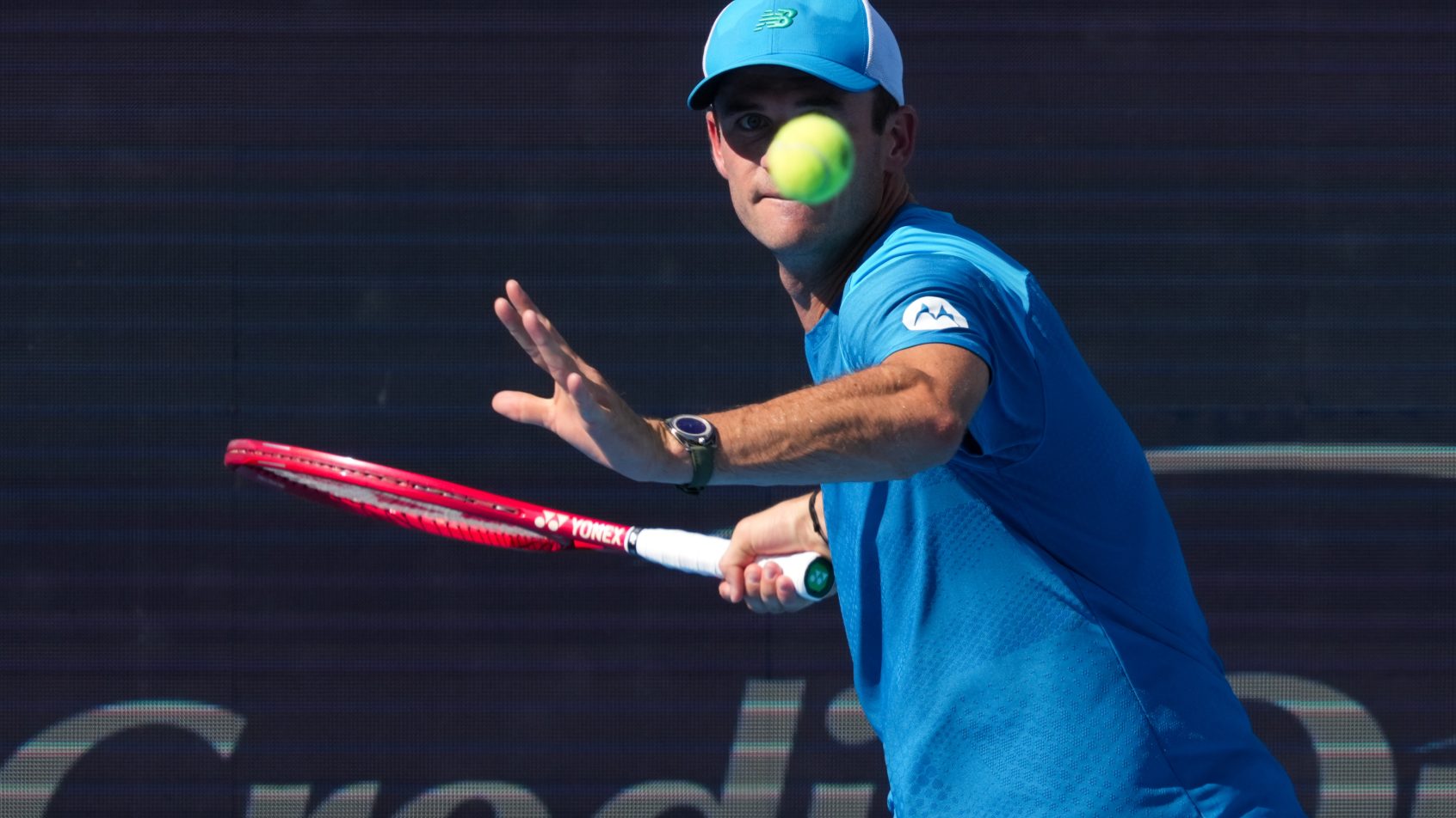 Tommy Paul preparing to hit forehand