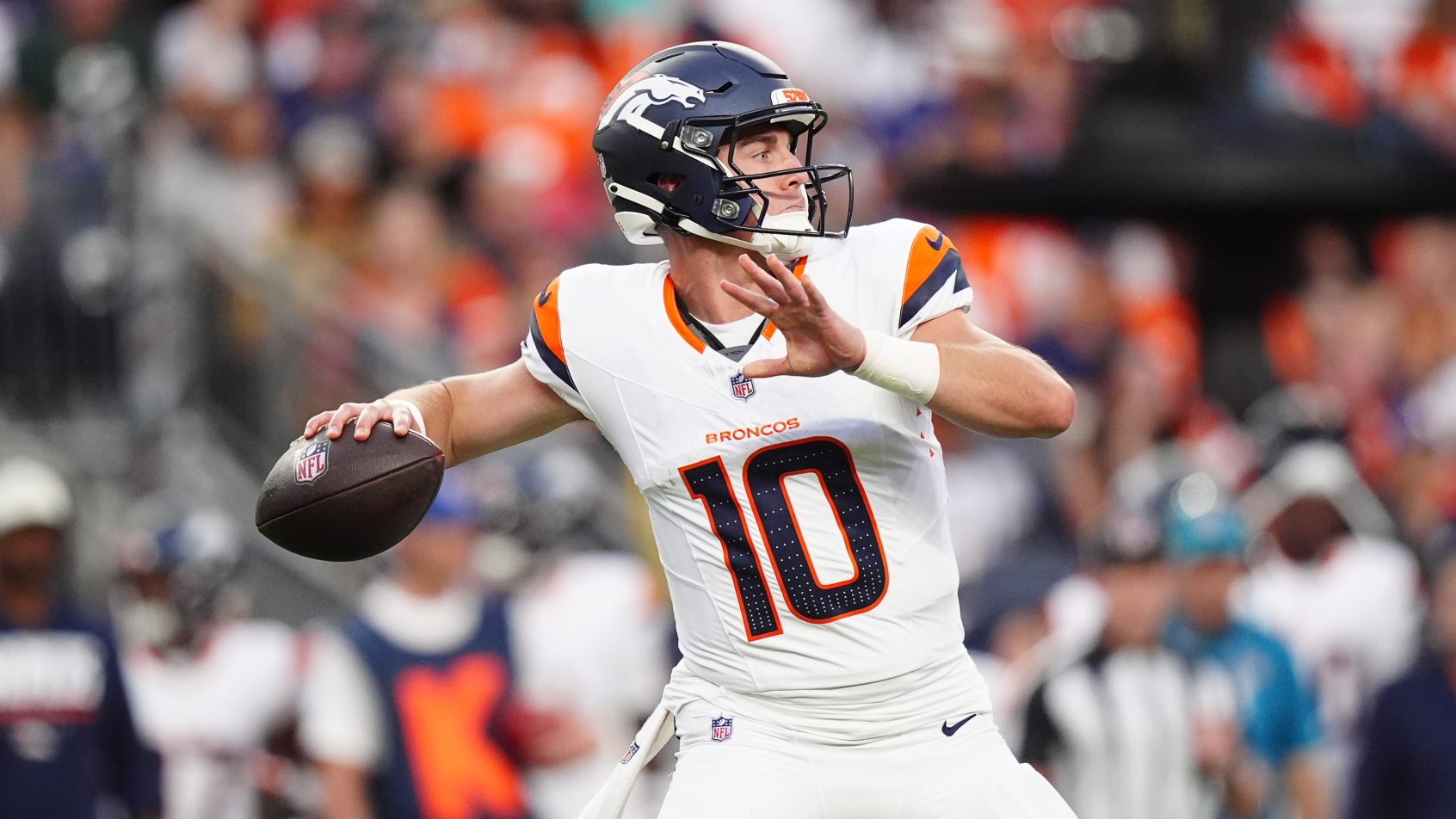 Bo Nix fires a pass during a preseason game.
