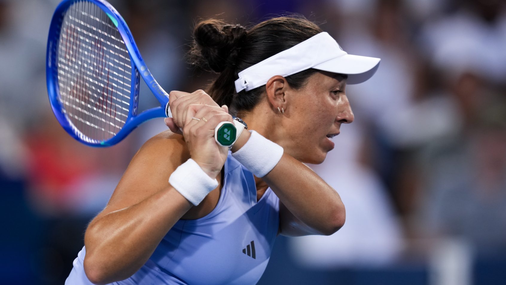 Jessica Pegula rips a backhand in a match vs Coco Gauff.