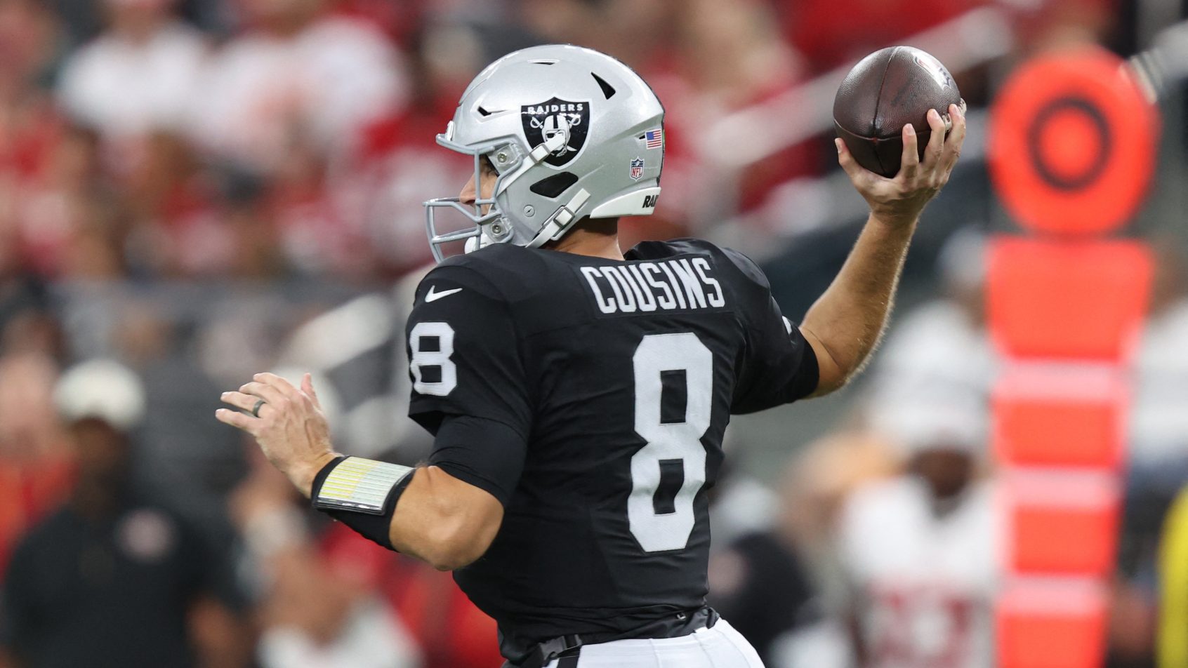 Las Vegas Raiders quarterback Kirk Cousins throwing a pass