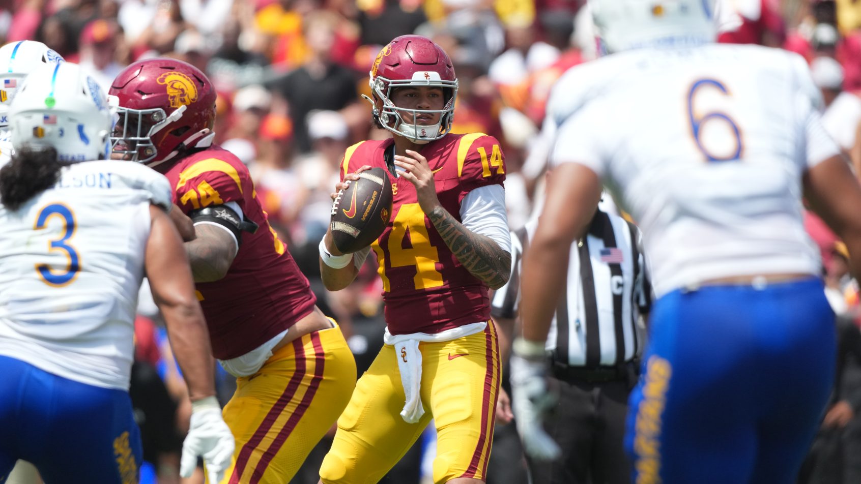 Jayden Maiava surveys the field in a game vs San Jose State.