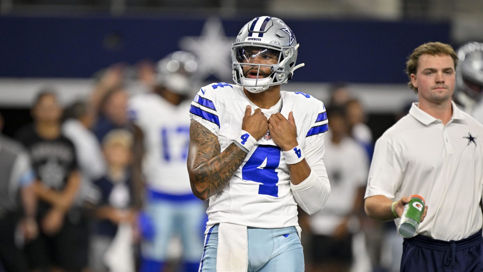 Dak Prescott on the sidelines during a Cowboys preseason game.