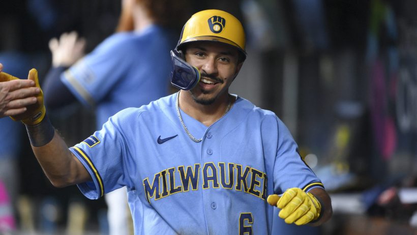 David Hamilton celebrates in the Brewers dugout.