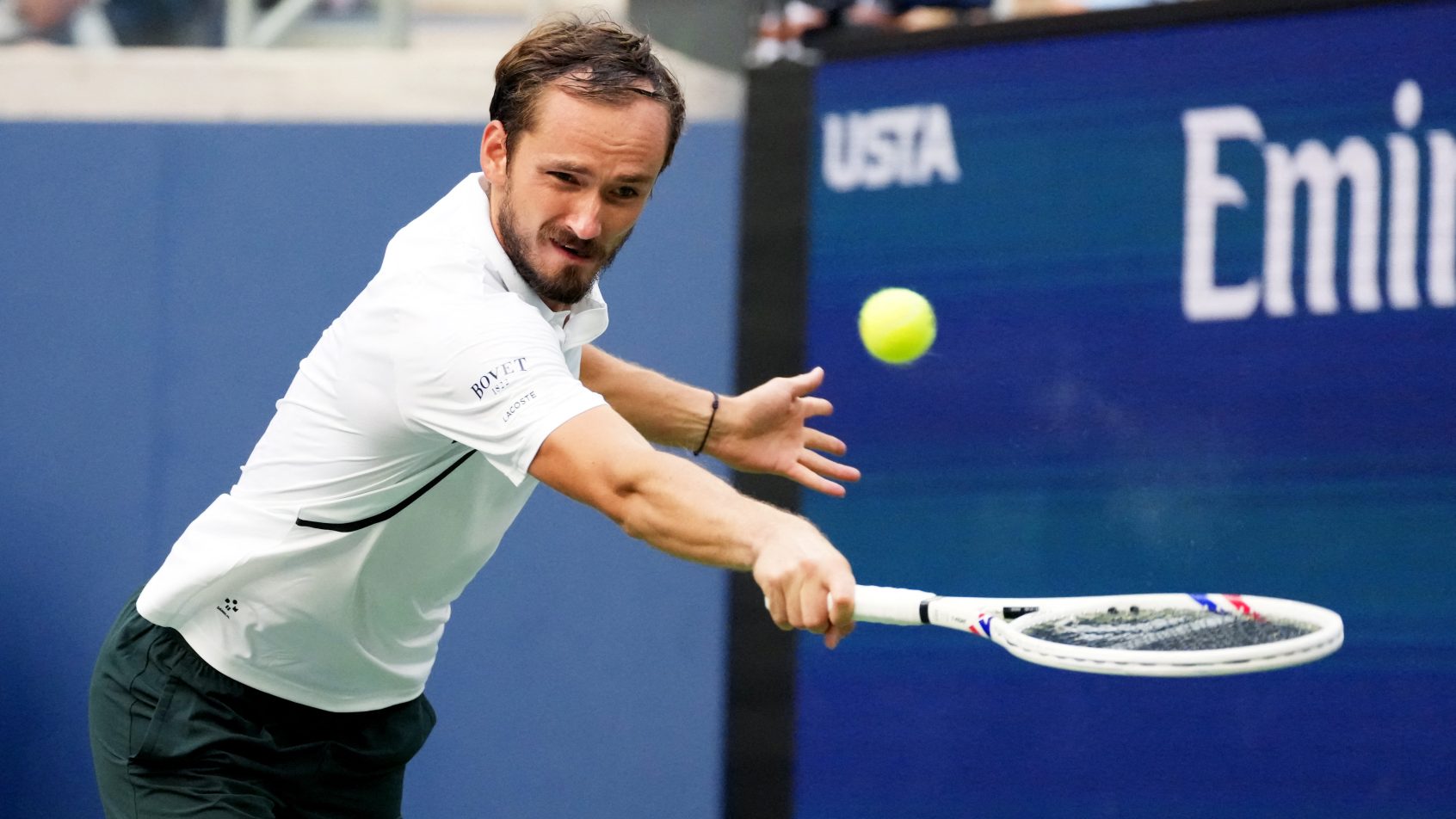 Daniil Medvedev chases down a Frances Tiafoe shot at the US Open.