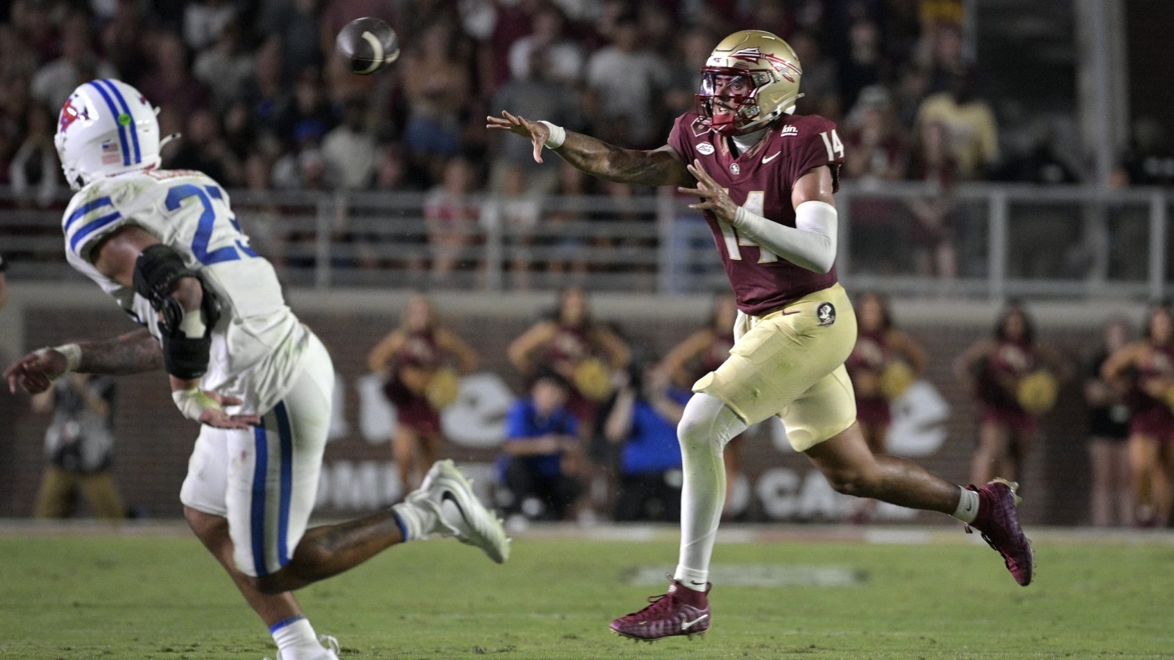 Ashton Daniels throws on the run for Florida State.