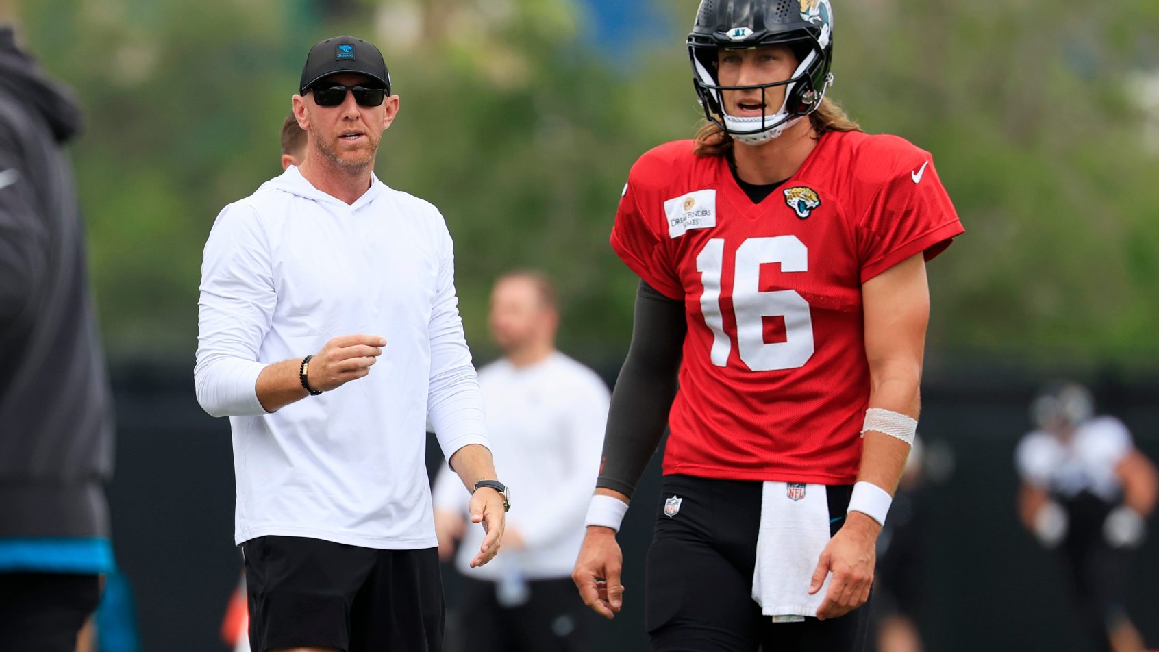Liam Cohen and Trevor Lawrence at practice