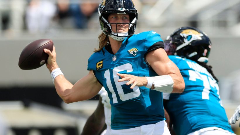 Trevor Lawrence preparing to throw the ball downfield