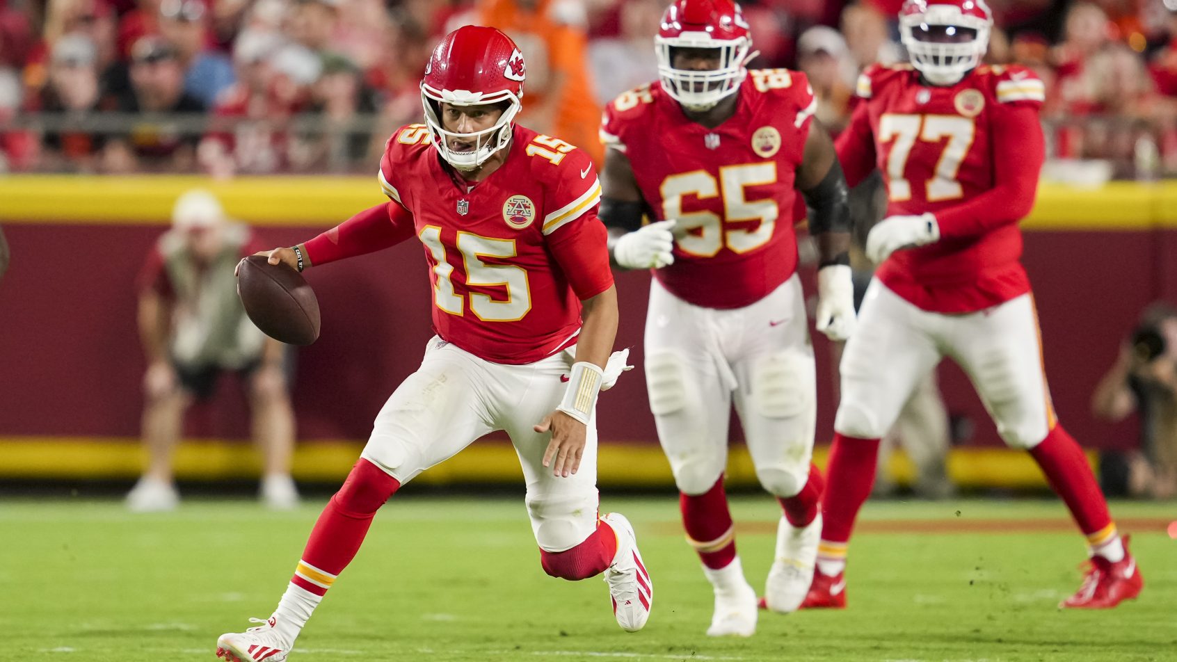 Patrick Mahomes rushes during a game against the Broncos.