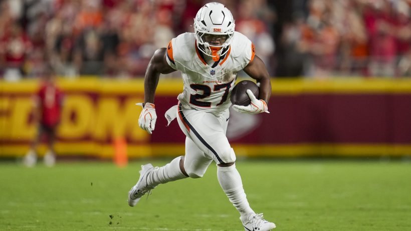 J.K. Dobbins rushes the ball in a game against the Chiefs.