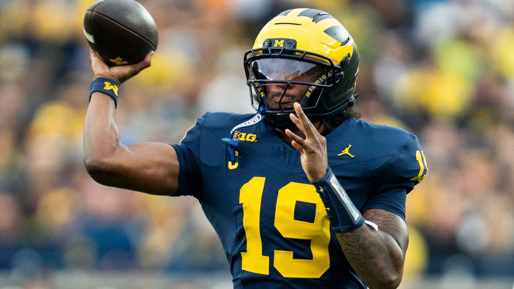 Michigan quarterback Bryce Underwood throws a pass against UTEP