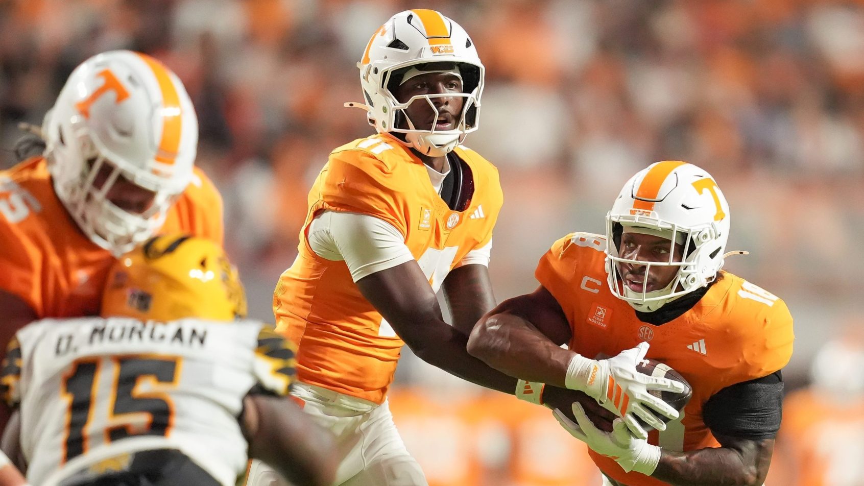 Faizon Brandon hands off to DeSean Bishop in a game vs Kennesaw State.
