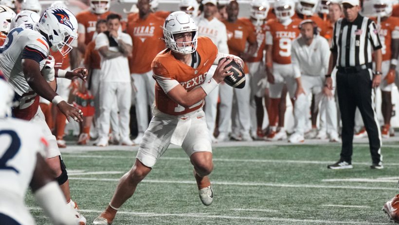 Arch Manning scrambles during a game against UTSA.