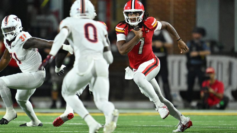 Maryland quarterback Malik Washington runs against Virginia Tech