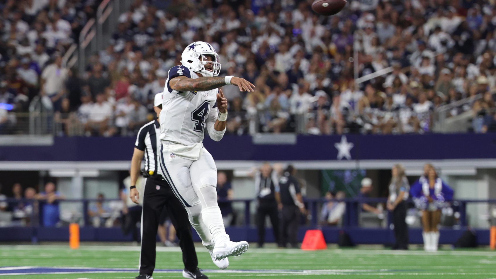 Dak Prescott throwing on the run
