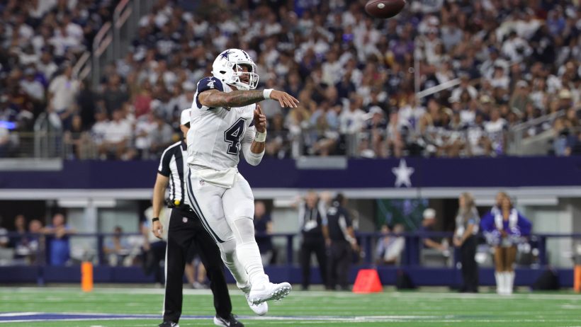 Dak Prescott throwing on the run