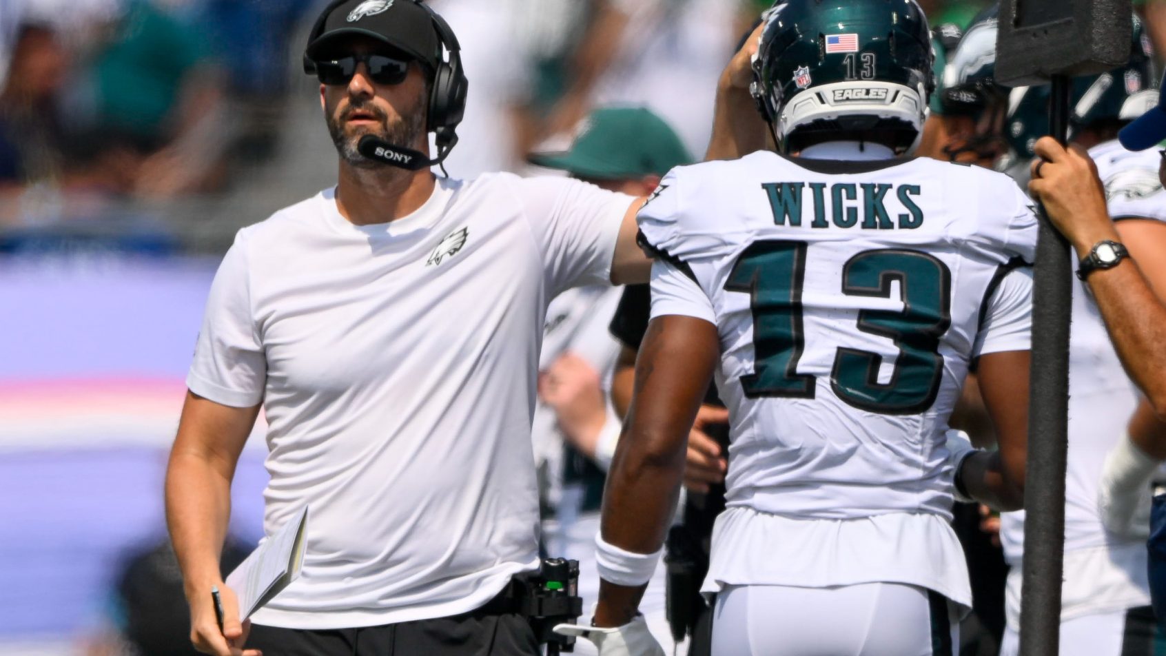 Dontayvion Wicks walking to the sideline