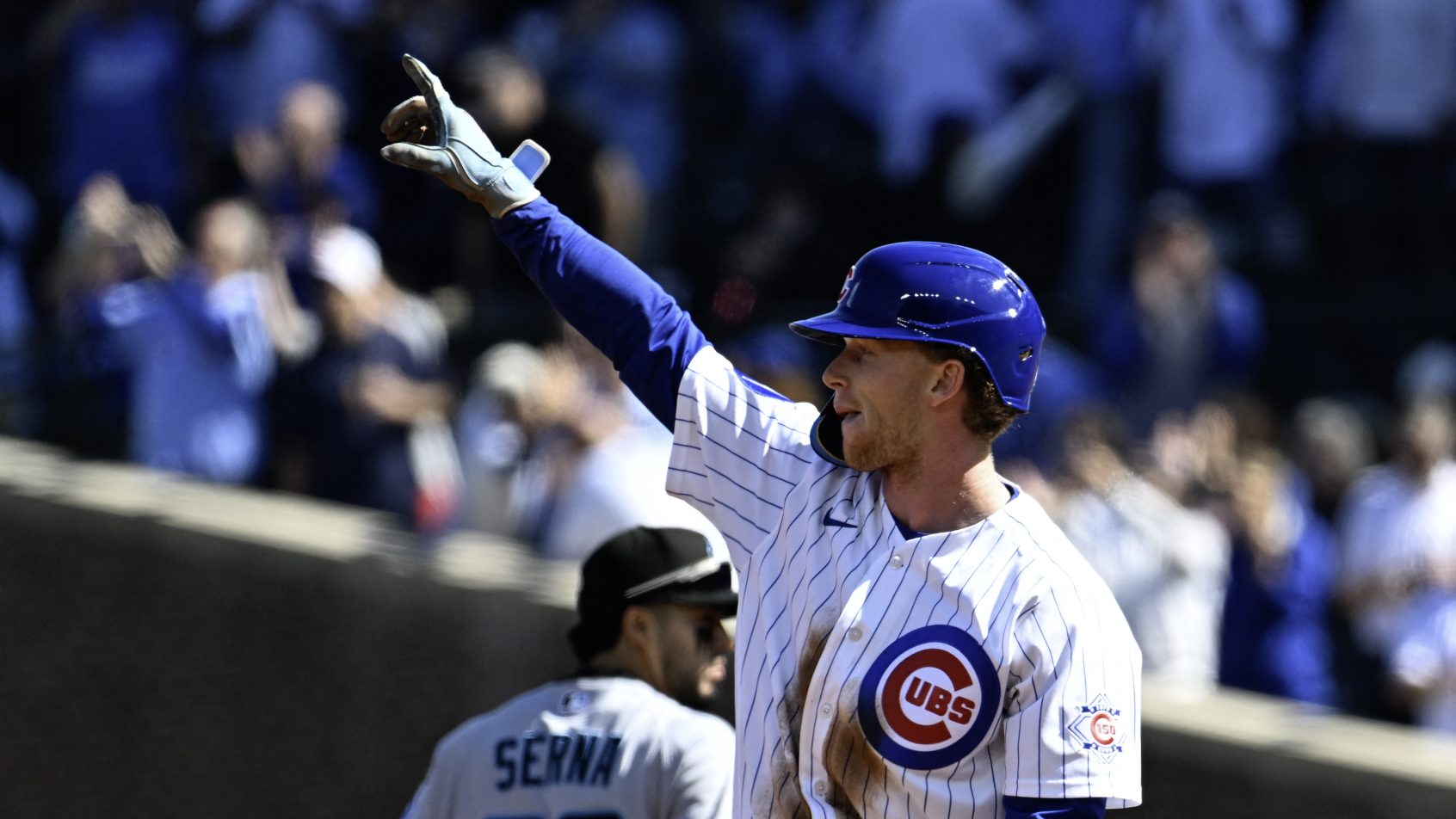 Pete Crow-Armstrong signals to the crow following another stolen base.