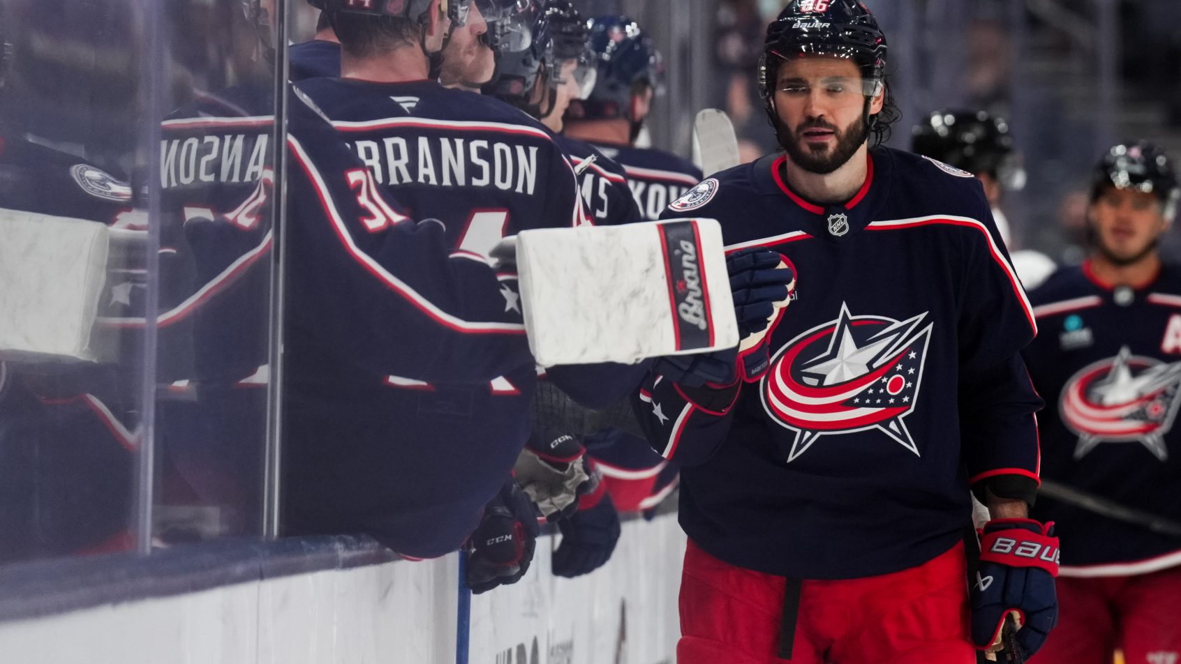 Kirill Marchenko celebrates a goal with Columbus Blue Jackets teammates