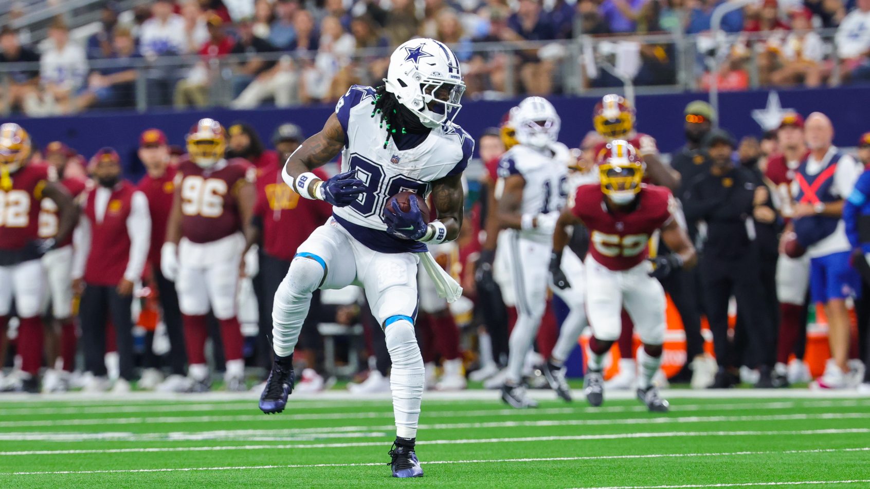 CeeDee Lamb hauls in a reception over the middle against the Commanders.
