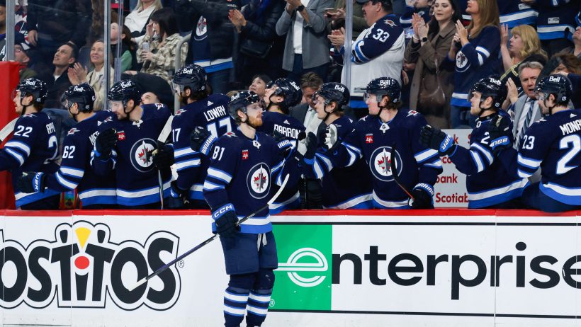 Kyle Connor celebrates with is team.