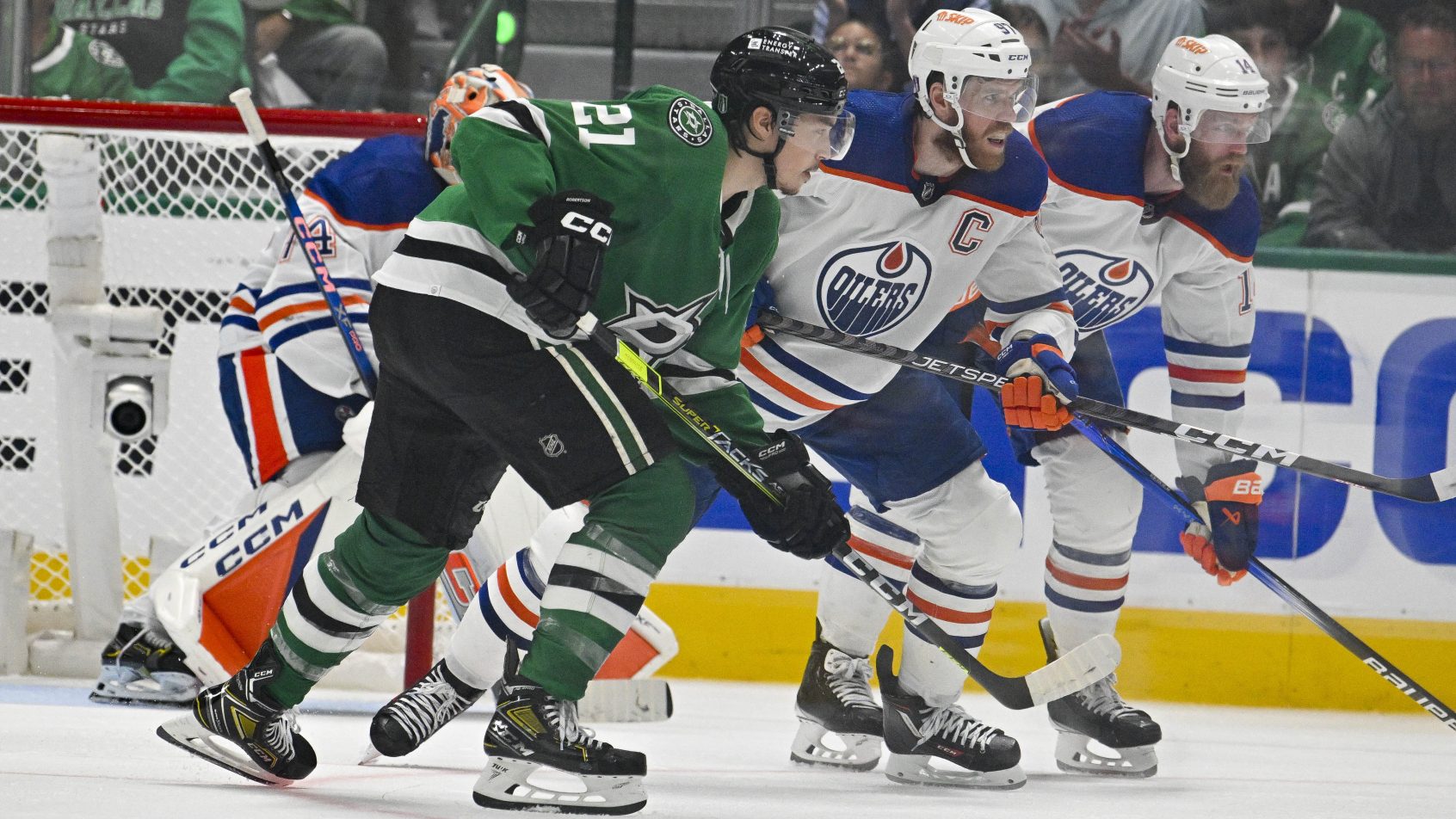 Jason Robertson and Edmonton Oilers Connor McDavid get ready for a face-off.
