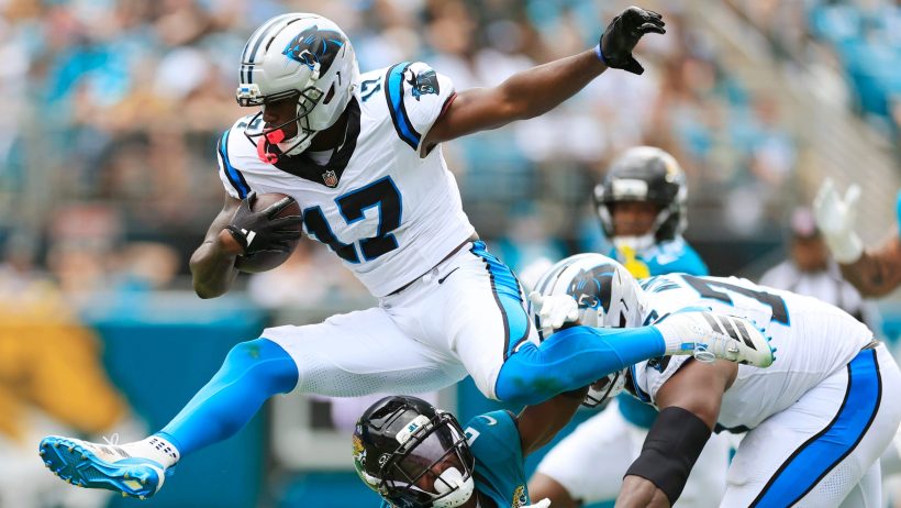 Xavier Legette leaps over a Jaguars defender.