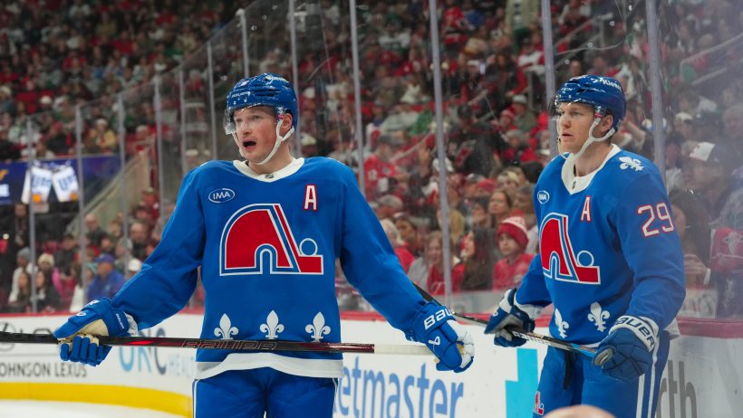 Cale Makar and center Nathan MacKinnon wait for the game to start.