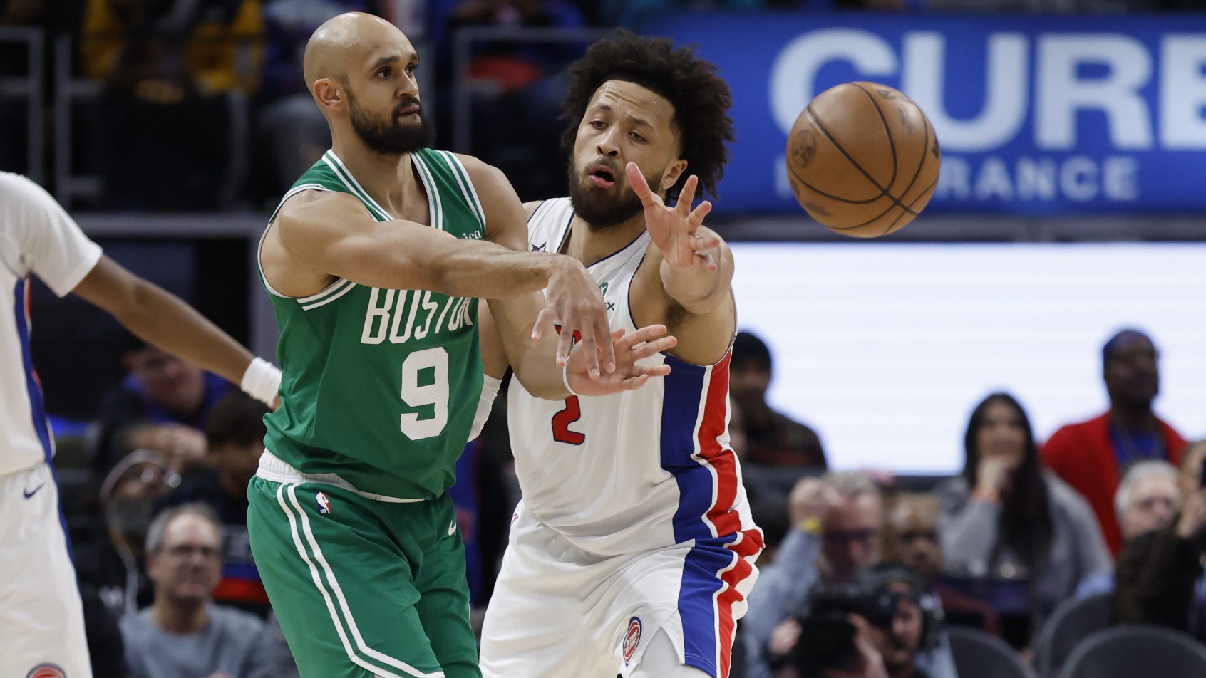 Derrick White and Cade Cunningham jostling for position
