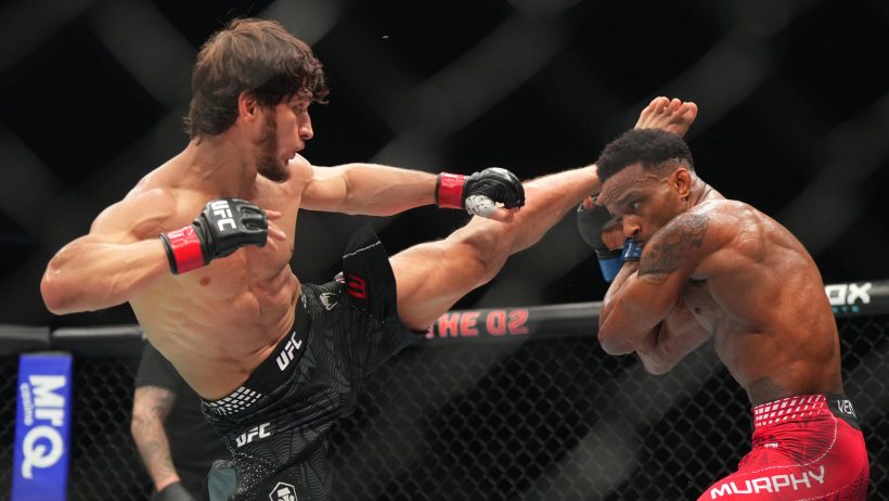 Movsar Evloev launches a kick towards Lerone Murphy's head.