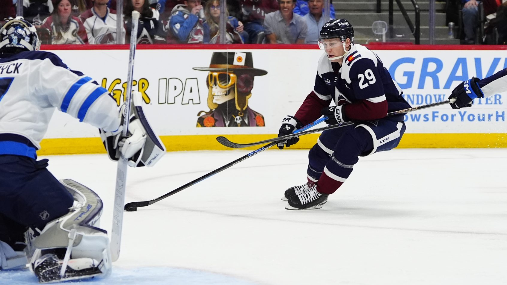 Nathan MacKinnon tries to score against the Jets