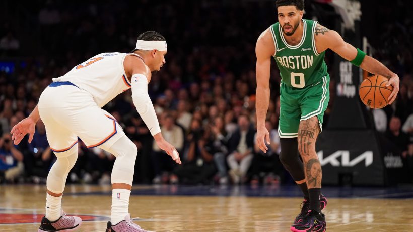 New York Knicks guard Josh Hart defends Boston Celtics forward Jayson Tatum.
