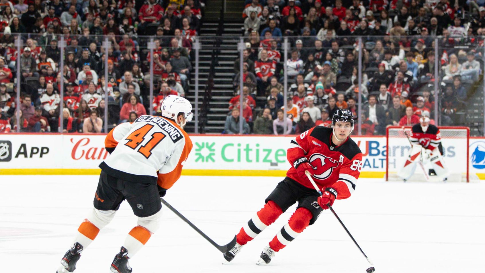 New Jersey Devils center Jack Hughes carries the puck against the Philadelphia Flyers