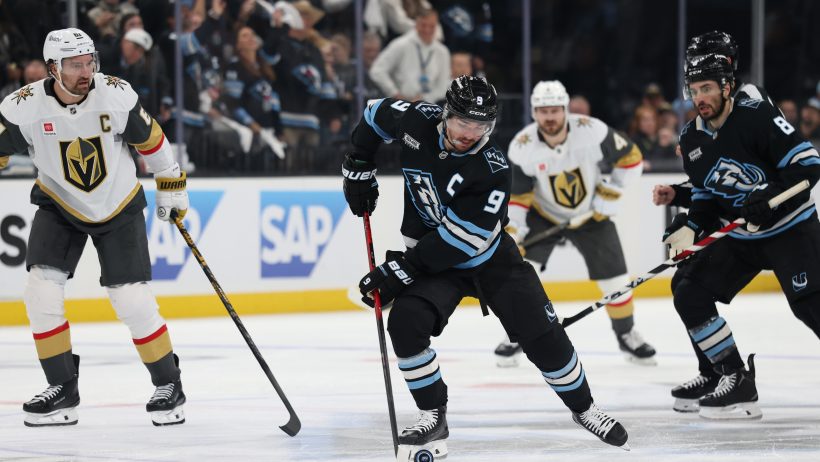 Utah Mammoth forward Clayton Keller plays the puck at Delta Center