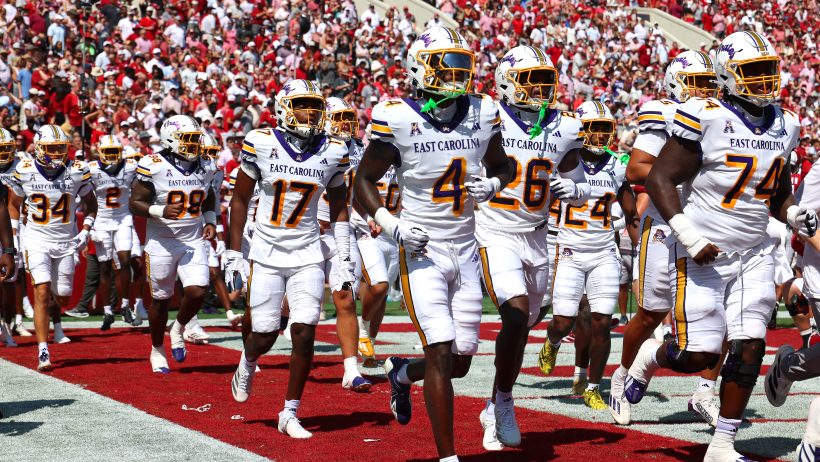 The East Carolina Pirates run onto the field before taking on Alabama.