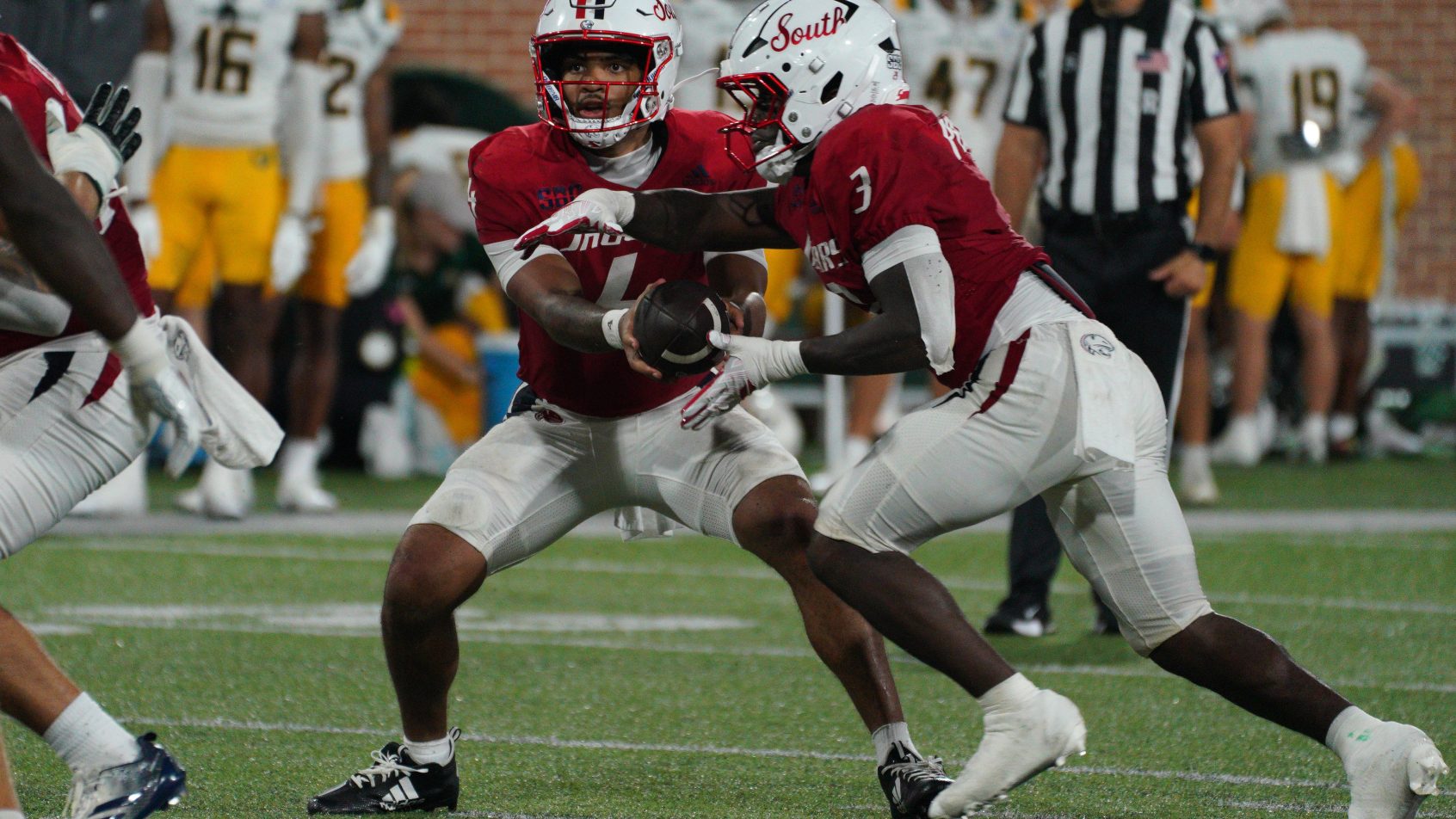 Bishop Davenport hands off to running back Keenan Phillips