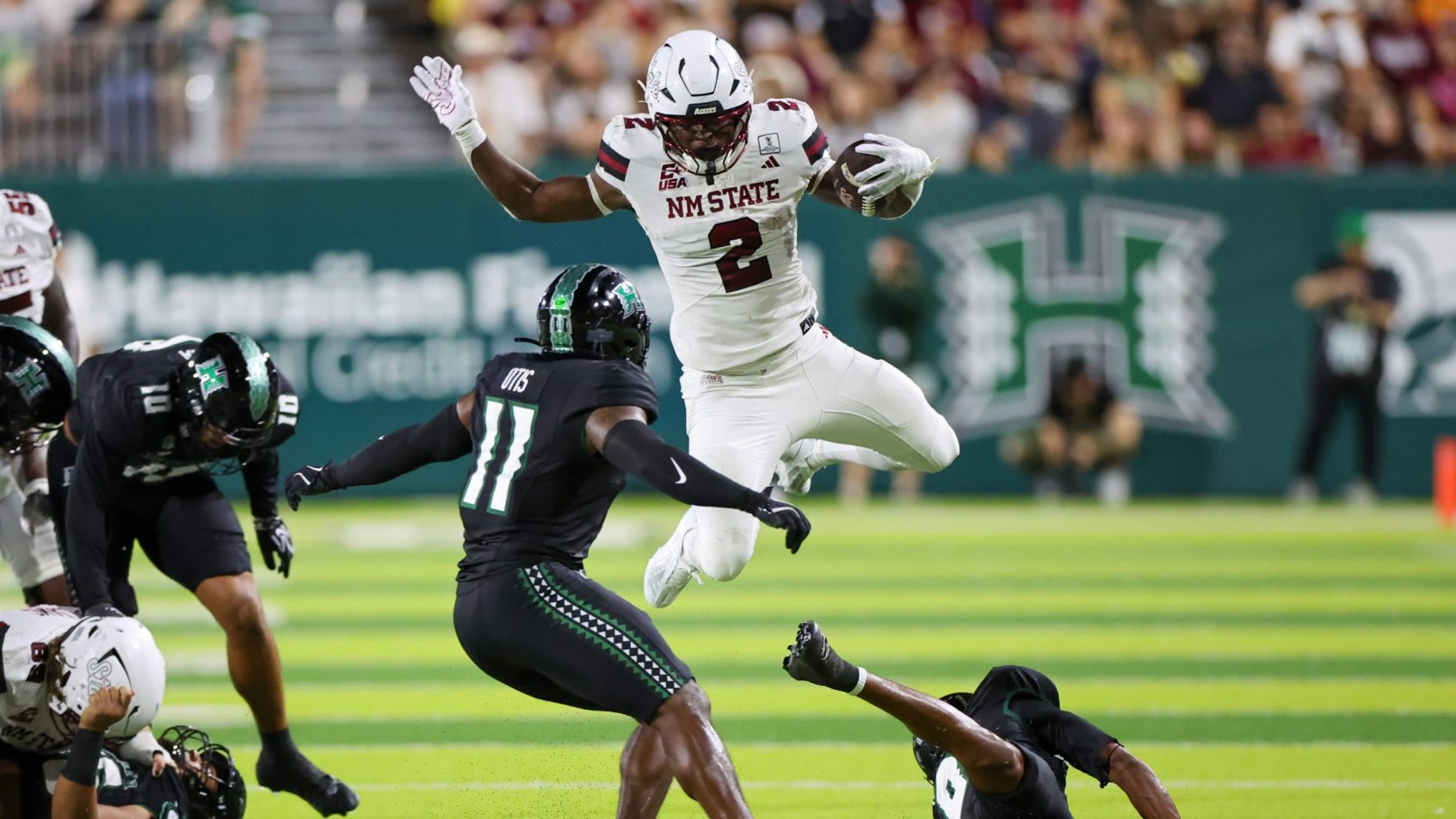 James Jones leaps over a defender in a game vs Hawaii.