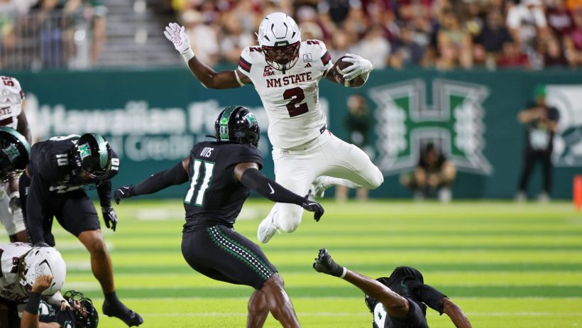 James Jones leaps over a defender in a game vs Hawaii.
