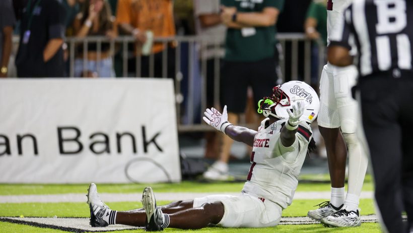 TK King celebrates a New Mexico State touchdown.