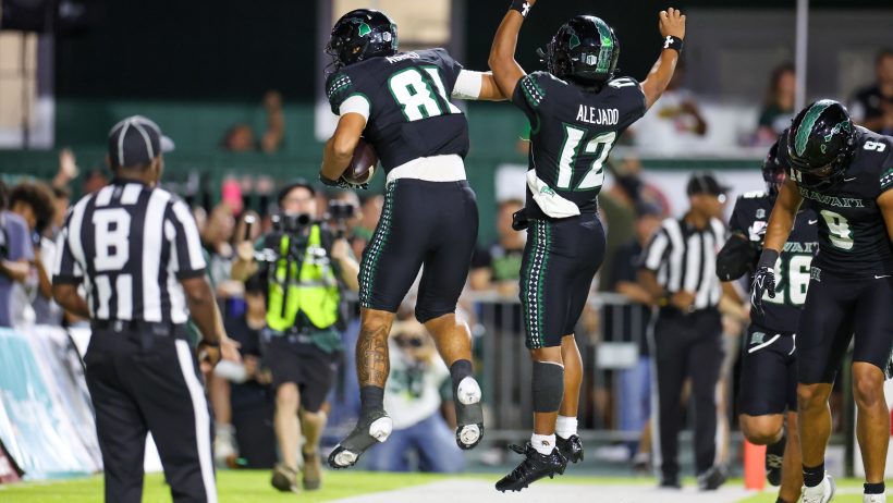 Hawaii players Frank Abreu and Micah Alejado celebrate a touchdown