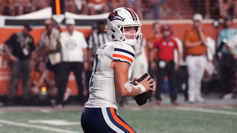 Owen McCown drops back to pass vs Texas.
