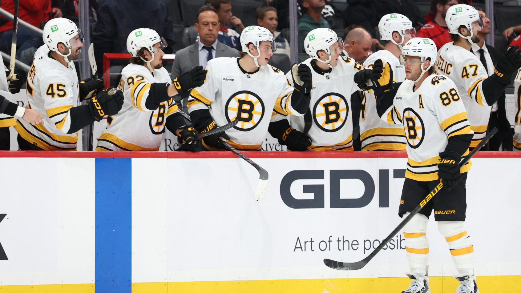 David Pastrnak celebrates with teammates