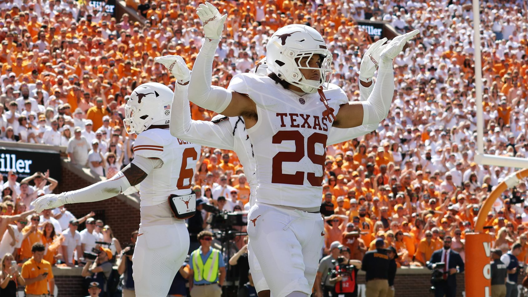 Texas' defense celebrates a stand against Tennessee.